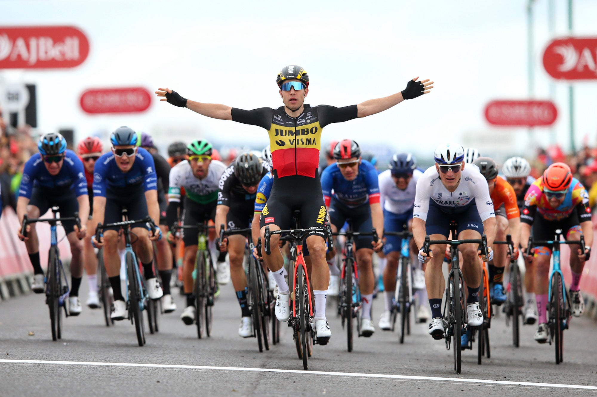 ABERDEEN, SCOTLAND - SEPTEMBER 12: Wout Van Aert of Belgium and Team Jumbo - Visma celebrates winning ahead of Mark Cavendish of United Kingdom and Team Deceuninck - Quick-Step, André Greipel of Germany and Team Israel Start-Up Nation and Ethan Hayter of United Kingdom and Team INEOS Grenadiers blue leader jersey during the 17th Tour of Britain 2021, Stage 8 a 173km stage from Stonehaven to Aberdeen / @TourofBritain / #TourofBritain / on September 12, 2021 in Aberdeen, Scotland. (Photo by Alex Livesey/Getty Images)