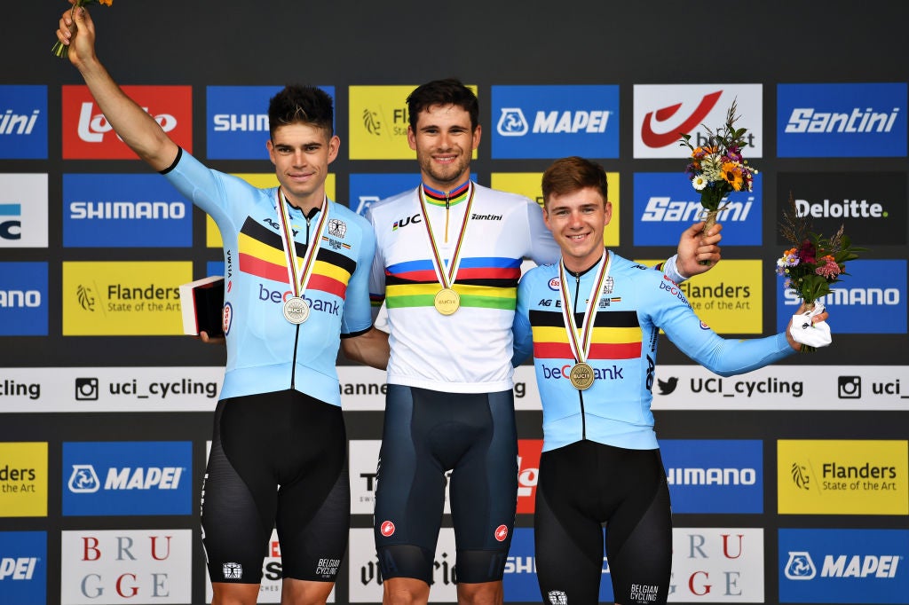 BRUGES, BELGIUM - SEPTEMBER 19: (L-R) Silver medalist Wout Van Aert of Belgium, gold medalist Filippo Ganna of Italy and bronze medalist Remco Evenepoel of Belgium pose on the podium during the medal ceremony after the 94th UCI Road World Championships 2021 - Men Elite ITT a 43,3km Individual Time Trial race from Knokke-Heist to Bruges / #flanders2021 / ITT / on September 19, 2021 in Bruges, Belgium. (Photo by Tim de Waele/Getty Images)