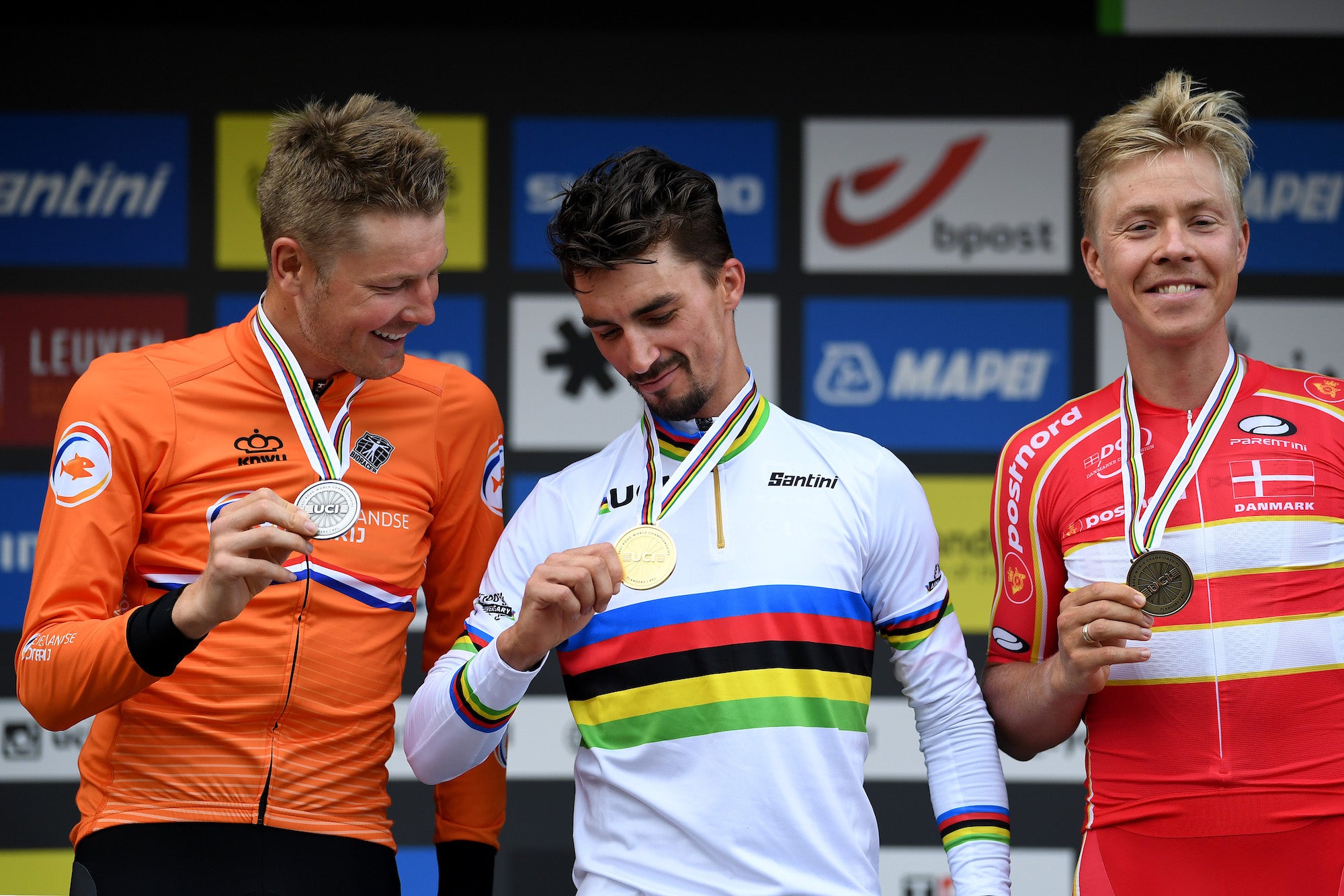 LEUVEN, BELGIUM - SEPTEMBER 26: (L-R) Silver medalist Dylan Van Baarle of The Netherlands, gold medalist Julian Alaphilippe of France and bronze medalist Michael Valgren Hundahl of Denmark pose on the podium during the medal ceremony after the 94th UCI Road World Championships 2021 - Men Elite Road Race a 268,3km race from Antwerp to Leuven / #flanders2021 / on September 26, 2021 in Leuven, Belgium. (Photo by Tim de Waele/Getty Images)