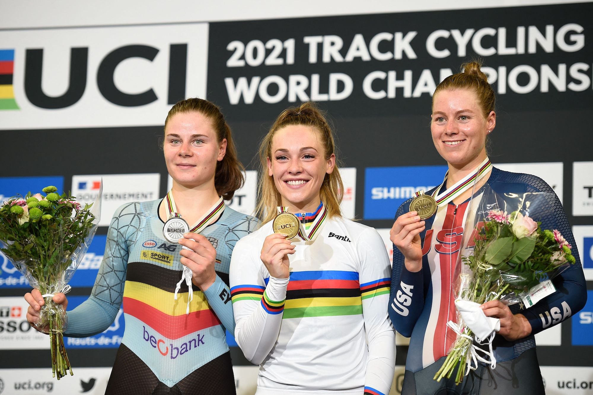 Italy's Letizia Paternoster (C) poses with her gold medal, flanked by silver medallist Belgium's Lotte Kopecky (L) and bronze medallist USA's Jennifer Valente on the podium of the women's Elimination Race during the UCI Track Cycling World Championships at Jean-Stablinski velodrome in Roubaix, northern France, on October 21, 2021. (Photo by FRANCOIS LO PRESTI / AFP) (Photo by FRANCOIS LO PRESTI/AFP via Getty Images)