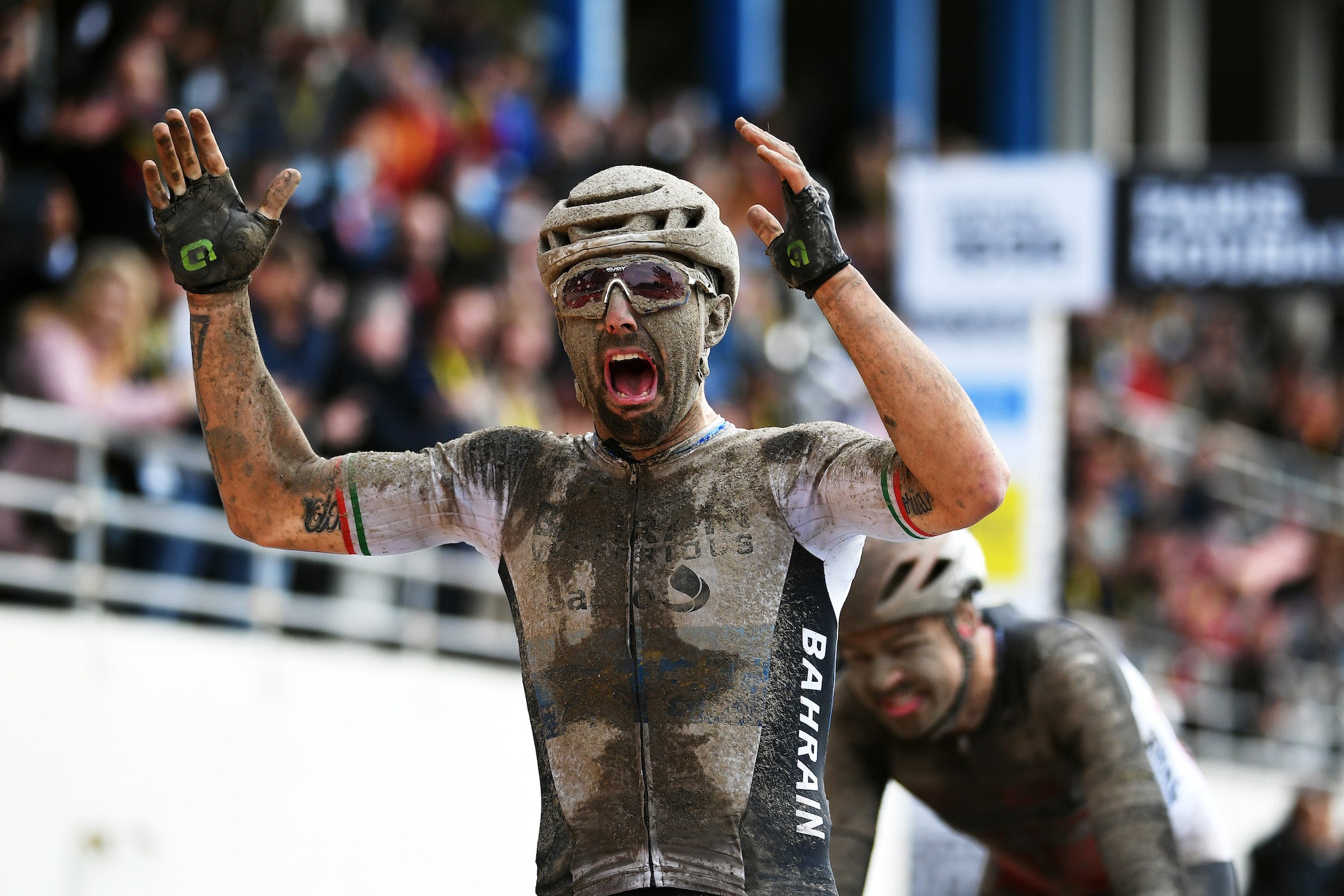 ROUBAIX, FRANCE - OCTOBER 03: Sonny Colbrelli of Italy and Team Bahrain Victorious covered in mud celebrates winning in the Roubaix Velodrome - Vélodrome André Pétrieux during the 118th Paris-Roubaix 2021 - Men's Eilte a 257,7km race from Compiègne to Roubaix / #ParisRoubaix / on October 03, 2021 in Roubaix, France. (Photo by Tim de Waele/Getty Images)
