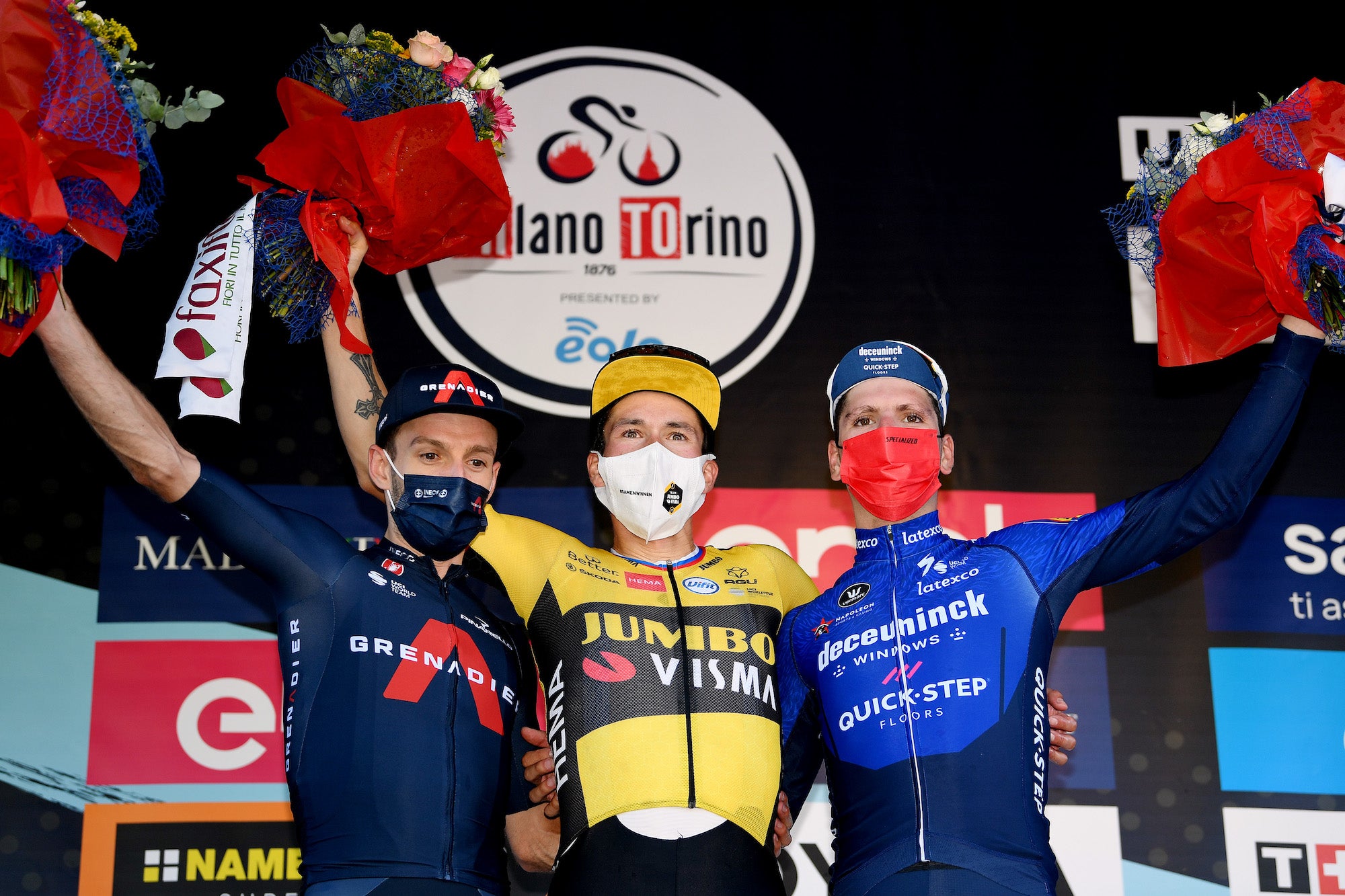 MILAN, ITALY - OCTOBER 06: (L-R) Adam Yates of United Kingdom and Team INEOS Grenadiers on second place, stage winner Primoz Roglic of Slovenia and Team Jumbo - Visma and Joao Almeida of Portugal and Team Deceuninck - Quick-Step on third place, pose on the podium during the podium ceremony after the 102nd Milano-Torino 2021 a 190km race from Magenta to Torino - Superga 669m / #MilanoTorino / on October 06, 2021 in Milan, Italy. (Photo by Tim de Waele/Getty Images)
