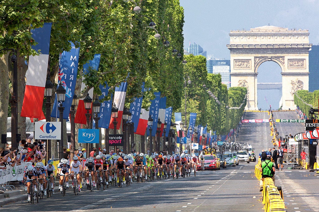 The women's peloton on the Champs Elysees for the first La Course