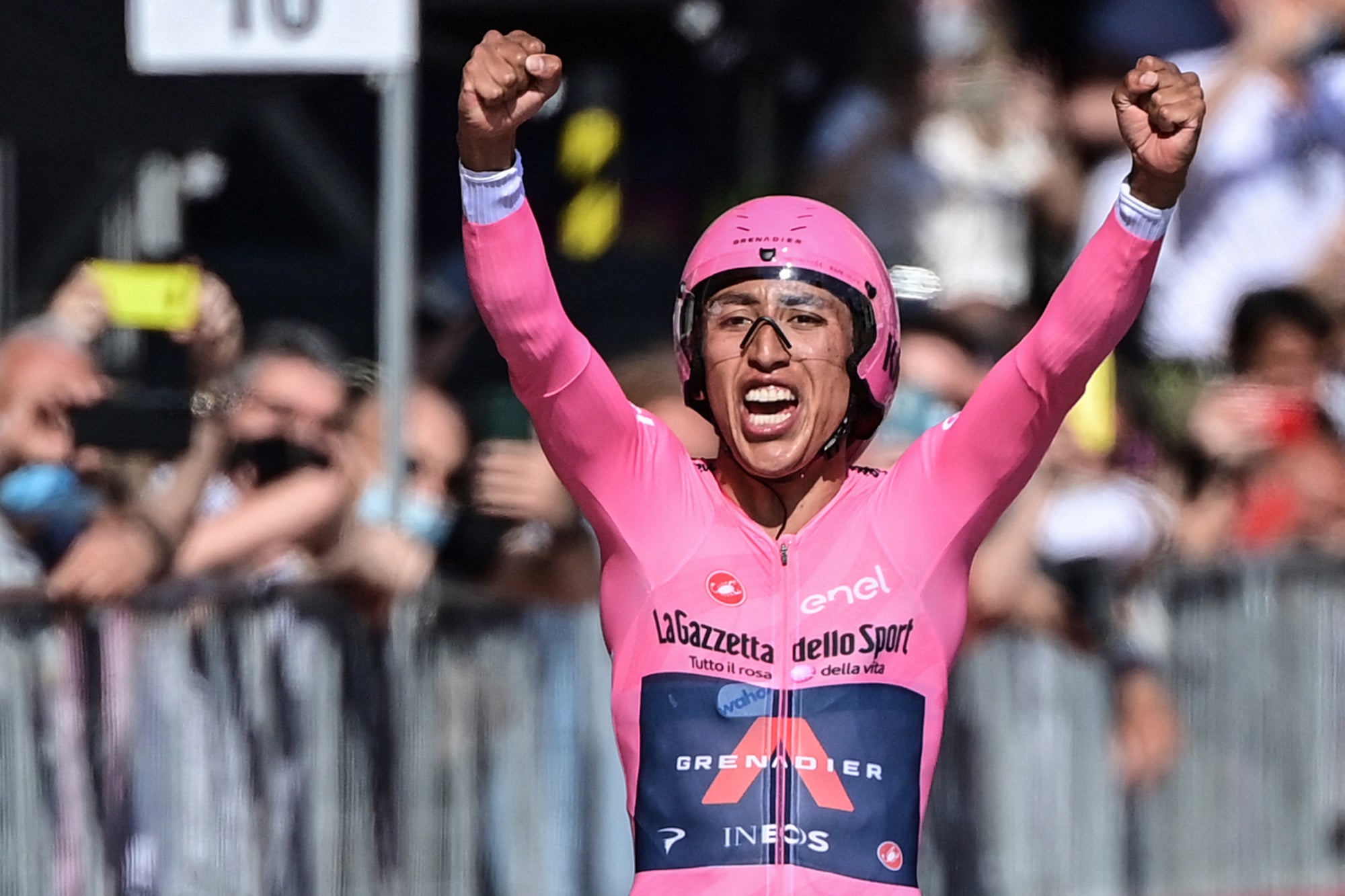 TOPSHOT - Overall leader Team Ineos rider Colombia's Egan Bernal celebrates as he crosses the finish line to win the Giro d'Italia 2021 cycling race, after the 21st and last stage of the Giro d'Italia 2021 cycling race, a 30.3km individual time trial between Senago and Milan on May 30, 2021. (Photo by MIGUEL MEDINA / AFP) (Photo by MIGUEL MEDINA/AFP via Getty Images)