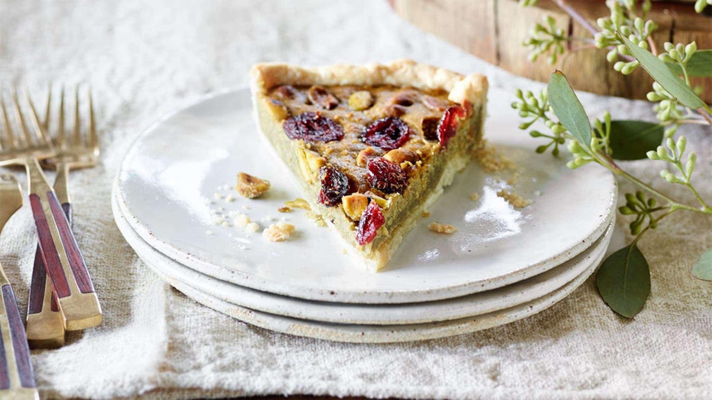 Slice of matcha frangipane tart