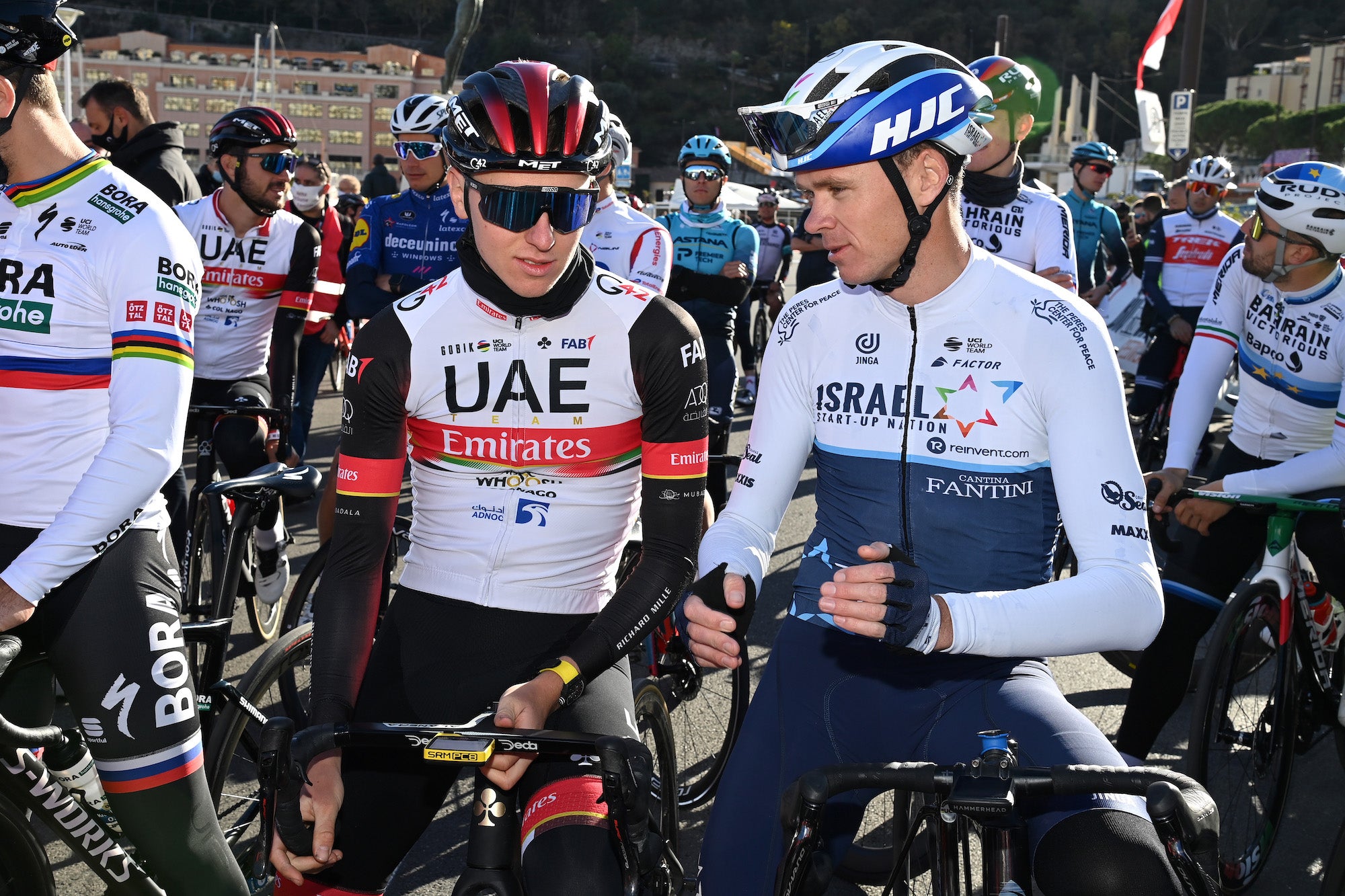 MONTE CARLO, FRANCE - NOVEMBER 28: (L to R) Tadej Pogacar and Chris Froome talk before the bike race during the cycling festival 'Monaco BeKing 2021' on November 28, 2021 in Monte Carlo, France. (Photo by Pascal Le Segretain/Getty Images)