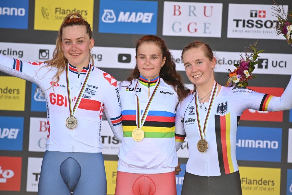 Alena Ivanchenko stands center stage after winning the junior world time trial title
