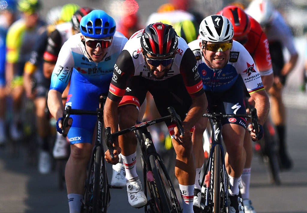 MUSCAT, OMAN - FEBRUARY 10: (L-R) Fernando Gaviria Rendon of Colombia and UAE Team Emirates, Kaden Groves of Australia and Team Bikeexchange - Jaycoand Mark Cavendish of United Kingdom and Team Quick-Step - Alpha Vinyl sprint at finish line during the 11th Tour Of Oman 2022 - Stage 1 a 138km stage from Al Rustaq Fort to Oman Convention and Exhibition Centre / #TourofOman / on February 10, 2022 in Muscat, Oman. (Photo by Dario Belingheri/Getty Images)