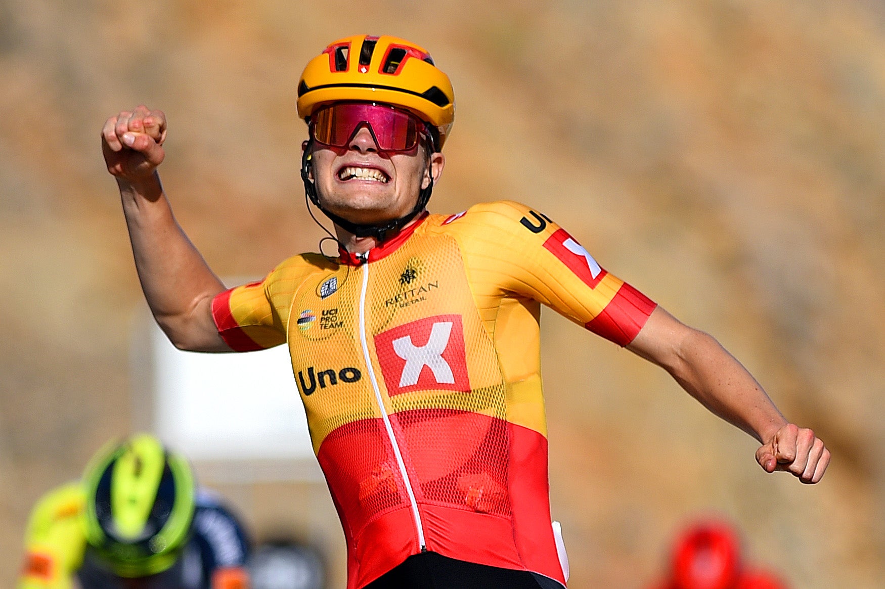 QURAYYAT, OMAN - FEBRUARY 12: Anthon Charmig of Denmark and UNO - X Pro Cycling Team celebrates winning during the 11th Tour Of Oman 2022 - Stage 3 a 180km stage from Sultan Qaboos University to Qurayyat 240m / #TourofOman / on February 12, 2022 in Qurayyat, Oman. (Photo by Dario Belingheri/Getty Images)