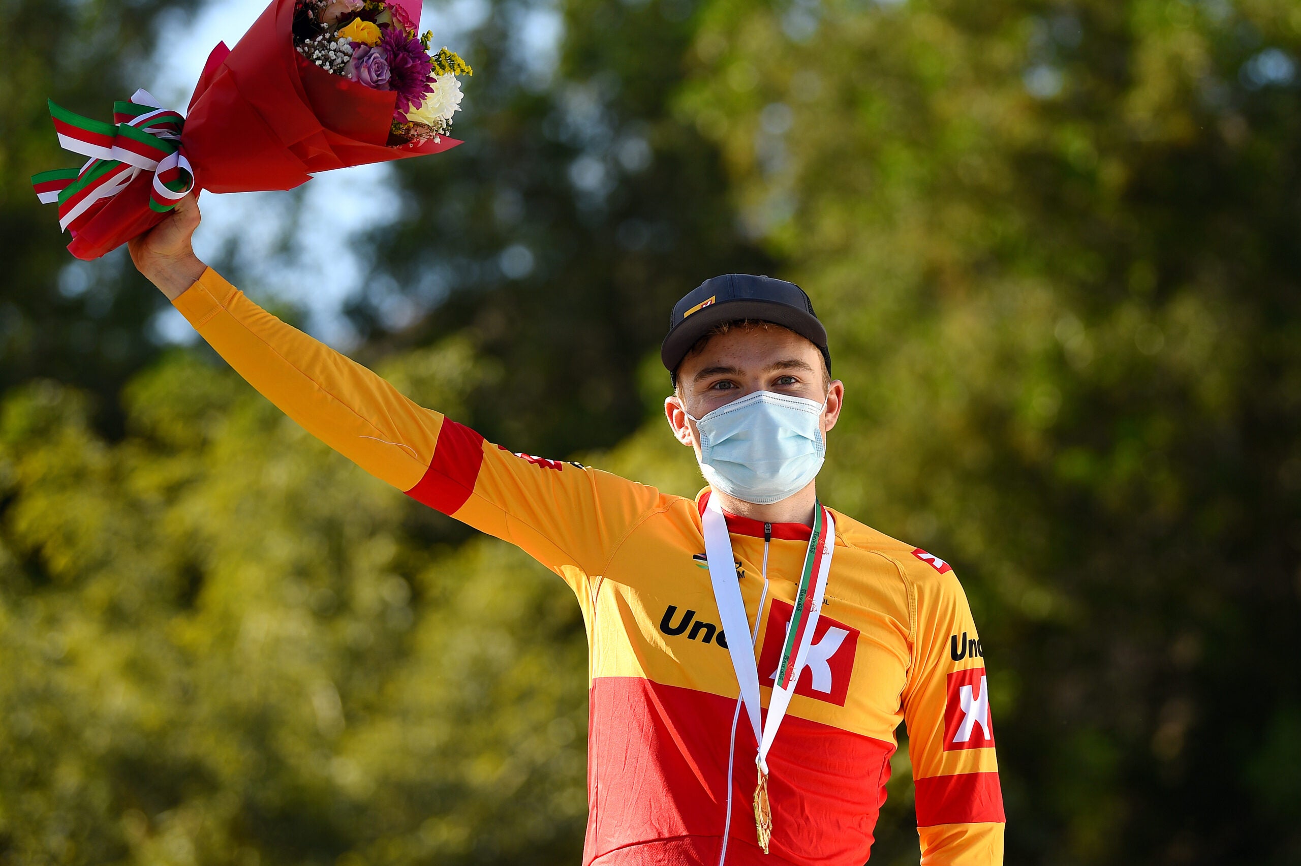 QURAYYAT, OMAN - FEBRUARY 12: Anthon Charmig of Denmark and UNO - X Pro Cycling Team celebrates winning the stage on the podium ceremony after the 11th Tour Of Oman 2022 - Stage 3 a 180km stage from Sultan Qaboos University to Qurayyat 240m / #TourofOman / on February 12, 2022 in Qurayyat, Oman. (Photo by Dario Belingheri/Getty Images)