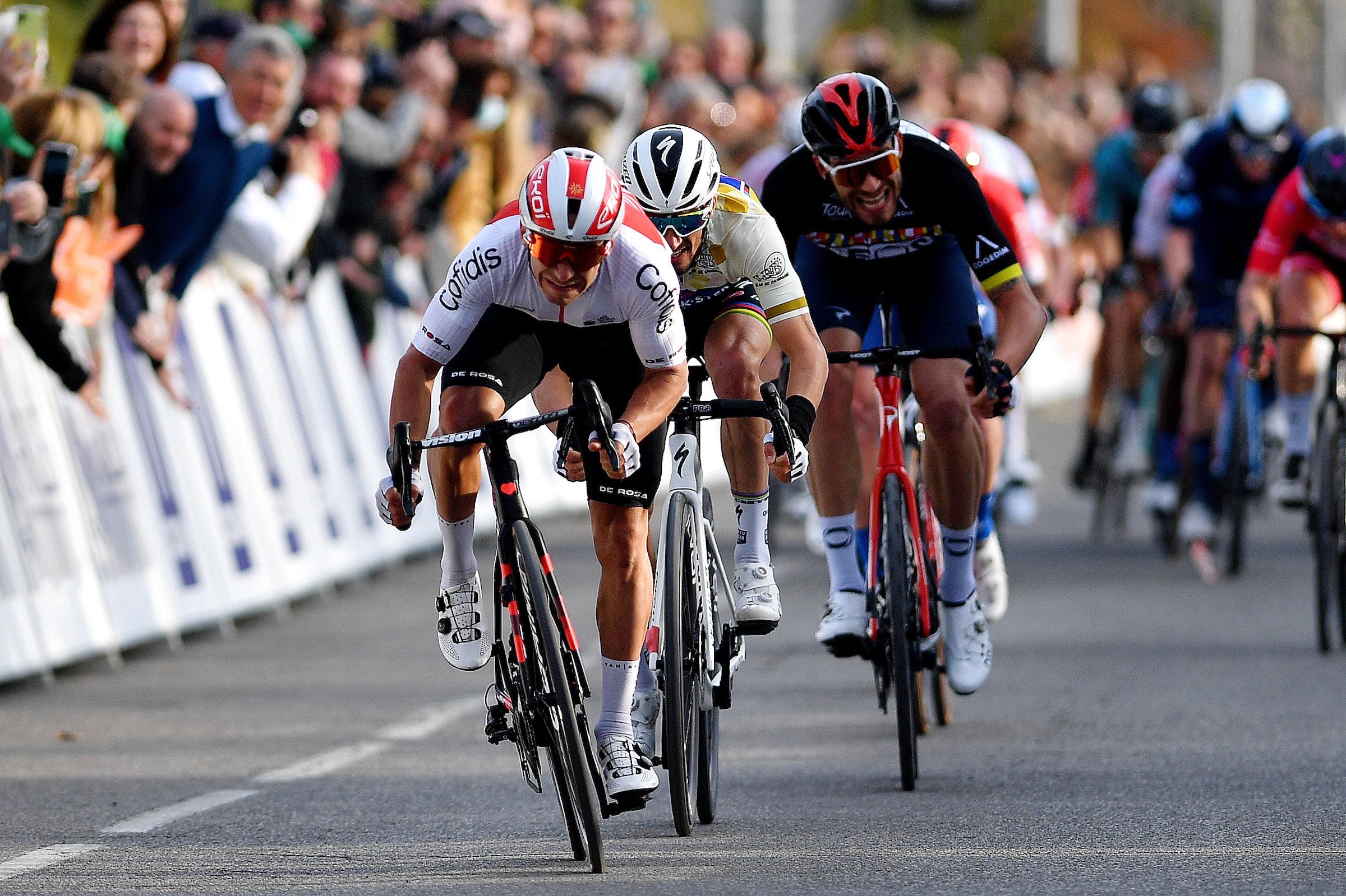 MANOSQUE, FRANCE - FEBRUARY 12: Bryan Coquard of France and Team Cofidis sprints to win ahead of Julian Alaphilippe of France and Team Quick-Step - Alpha Vinyl Brown Points Jersey and Filippo Ganna of Italy and Team INEOS Grenadiers Black Leader Jersey during the 6th Tour de La Provence 2022, Stage 2 a 180,6km stage from Arles to Manosque 417m / #TDLP22 / on February 12, 2022 in Manosque, France. (Photo by Luc Claessen/Getty Images)