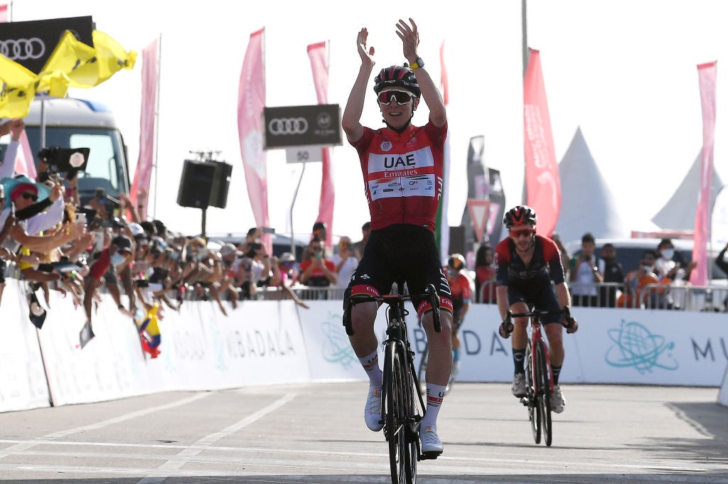 JEBEL HAFEET, UNITED ARAB EMIRATES - FEBRUARY 26: Tadej Pogacar of Slovenia and UAE Team Emirates Red Leader Jersey celebrates at finish line as stage winner ahead of Adam Yates of United Kingdom and Team INEOS Grenadiers during the 4th UAE Tour 2022 - Stage 7 a 148km stage from Al Jahili Fort to Jebel Hafeet 1025m /  #UAETour / #WorldTour / on February 26, 2022 in Jebel Hafeet, United Arab Emirates. (Photo by Tim de Waele/Getty Images)