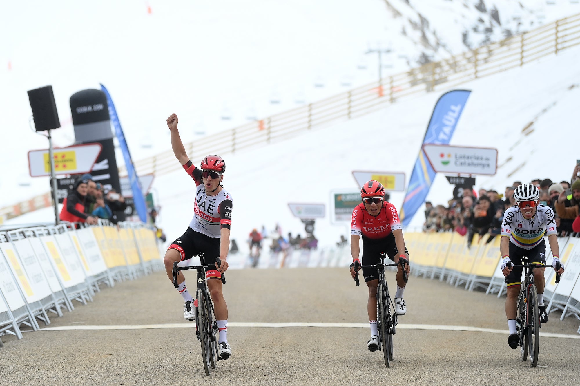BOÍ TAÜLL, SPAIN - MARCH 24: lJoão Almeida of Portugal and UAE Team Emirates celebrates at finish line as stage winner ahead of Nairo Alexander Quintana Rojas of Colombia and Team Arkéa - Samsic and Sergio Andres Higuita Garcia of Colombia and Team Bora - Hansgrohe during the 101st Volta Ciclista a Catalunya 2022 - Stage 4 a 166,5km stage from La Seu d'Urgell to Boí Taüll 2015m / #VoltaCatalunya101 / #WorldTour / on March 24, 2022 in Boí Taüll, Spain. (Photo by David Ramos/Getty Images)