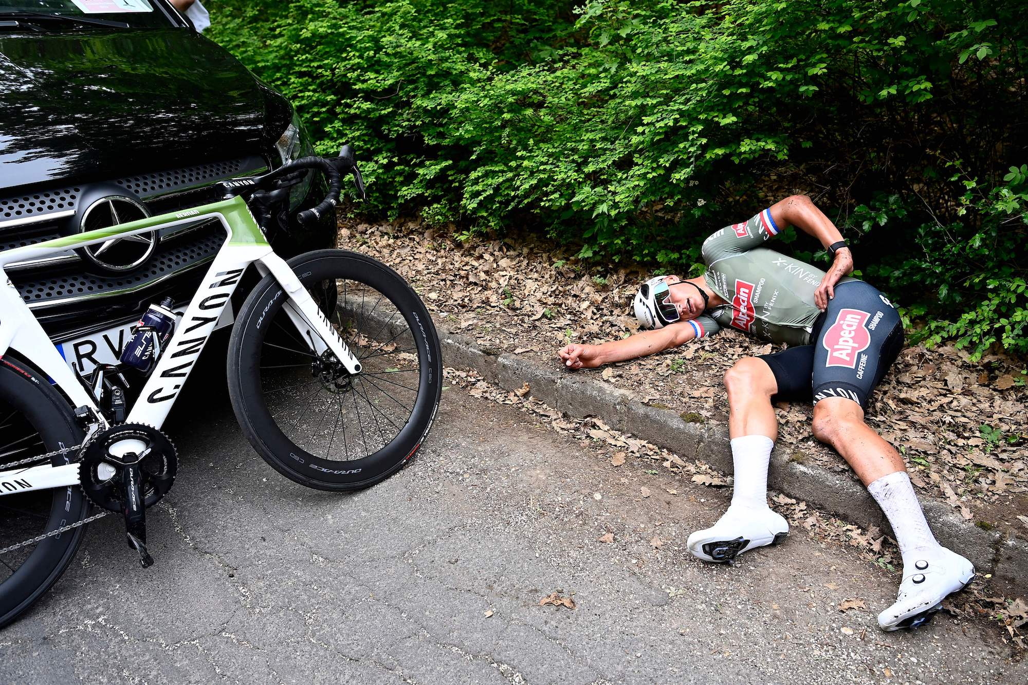 Mathieu van der Poel collapses after winning the pink jersey. 