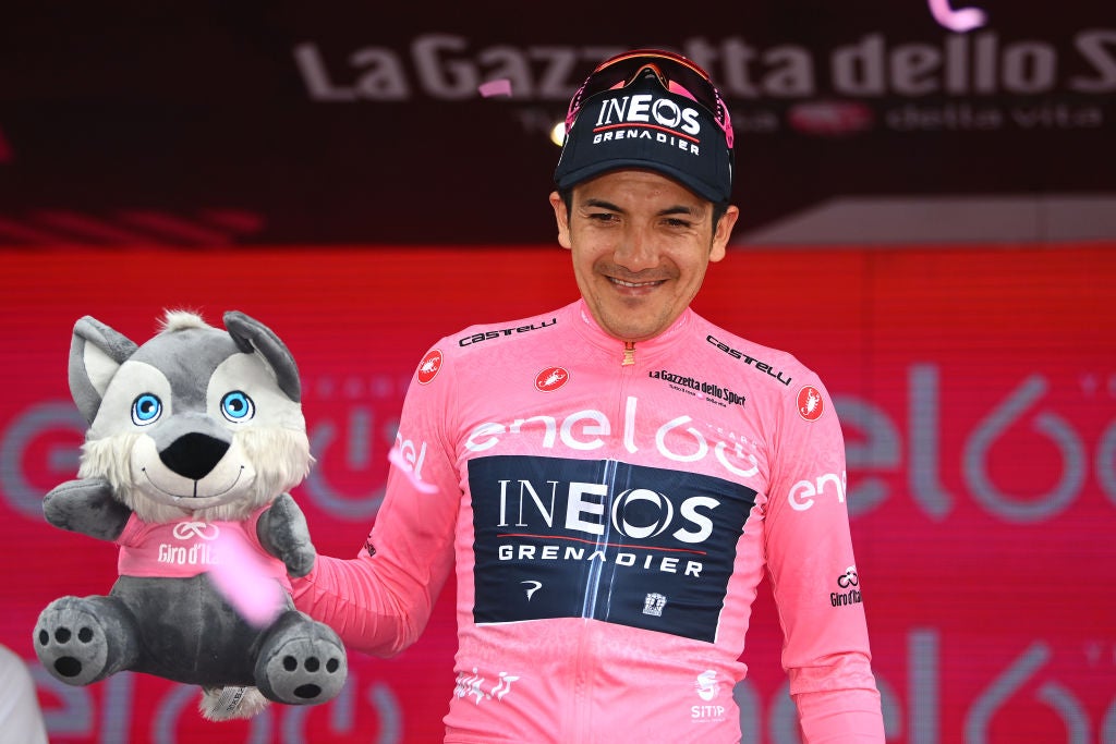 COGNE, ITALY - MAY 22: Richard Carapaz of Ecuador and Team INEOS Grenadiers Pink Leader Jersey celebrates at podium during the 105th Giro d'Italia 2022, Stage 15 a 177km stage from Rivarolo Canavese to Cogne 1622m / #Giro / #WorldTour / on May 22, 2022 in Cogne, Italy. (Photo by Tim de Waele/Getty Images)