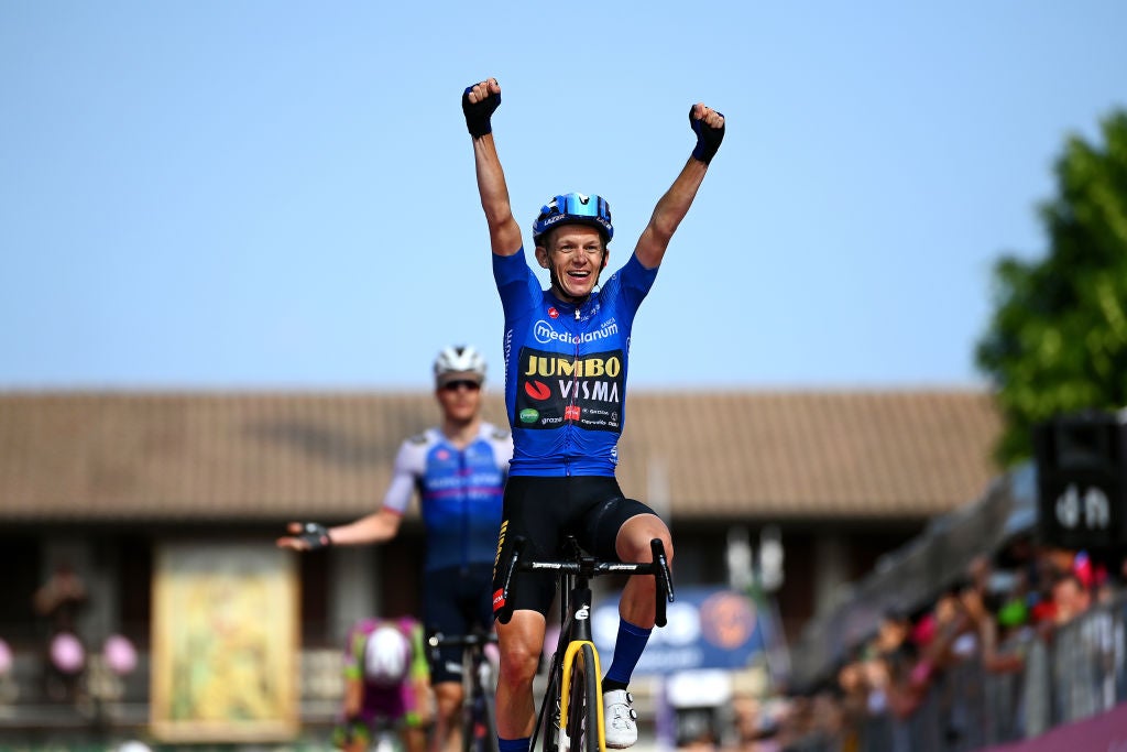 SANTUARIO DI CASTELMONTE, ITALY - MAY 27: Koen Bouwman of Netherlands and Team Jumbo - Visma Team Blue Mountain Jersey celebrates at finish line as stage winner ahead of Mauro Schmid of Switzerland and Team Quick-Step - Alpha Vinyl during the 105th Giro d'Italia 2022, Stage 19 a 178km stage from Marano Lagunare to Santuario di Castelmonte 577m / #Giro / #WorldTour / on May 27, 2022 in Santuario di Castelmonte, Italy. (Photo by Tim de Waele/Getty Images)