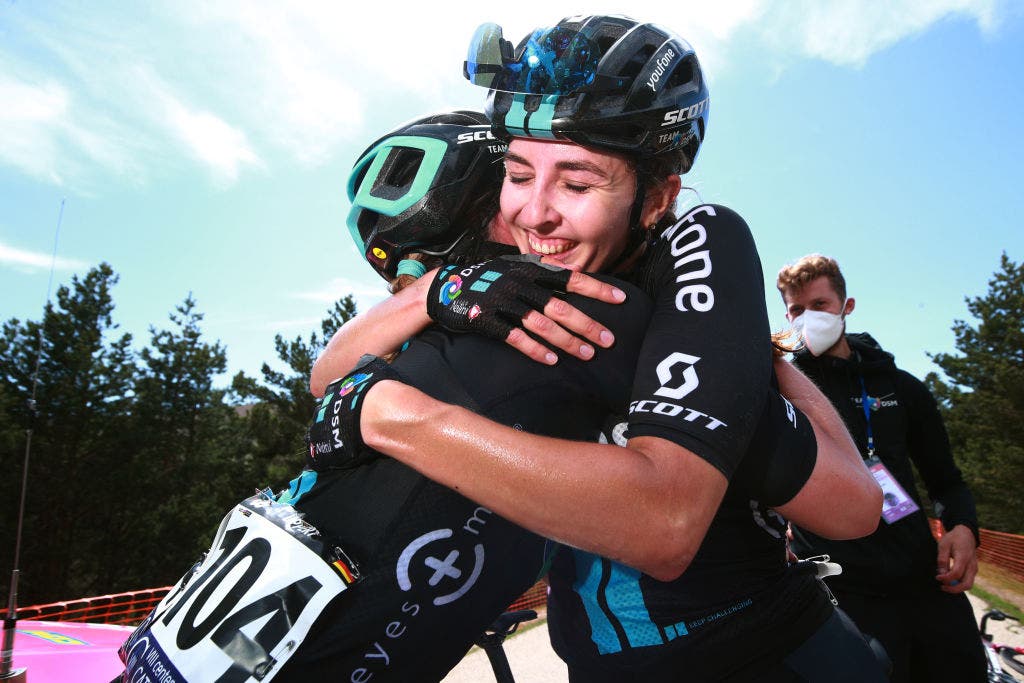 LAGUNAS DE NEILA, SPAIN - MAY 22: (L-R) Liane Lippert of Germany and final race overall winner Juliette Labous of France and Team DSM celebrate after the 7th Vuelta a Burgos Feminas 2022 - Stage 4 a 125,1km stage from Covarrubias to Lagunas de Neila 1867m / #VueltaBurgos / #BurgosFem / #UCIWWT / on May 22, 2022 in Lagunas de Neila, Spain. (Photo by Gonzalo Arroyo Moreno/Getty Images)