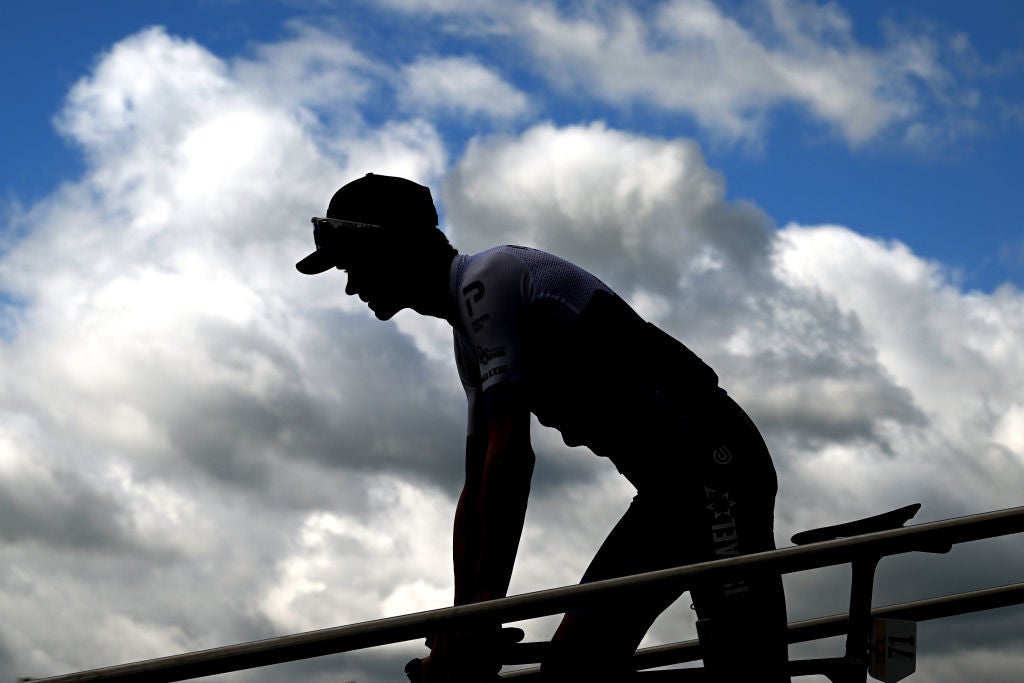 CHASTREIX-SANCY, FRANCE - JUNE 07: Silhouette of Christopher Froome of United Kingdom and Team Israel - Premier Tech during the team presentation prior to the 74th Criterium du Dauphine 2022 - Stage 3 a 169km stage from Saint-Paulien to Chastreix-Sancy 1391m / #WorldTour / #Dauphiné / on June 07, 2022 in Chastreix-Sancy, France. (Photo by Dario Belingheri/Getty Images)