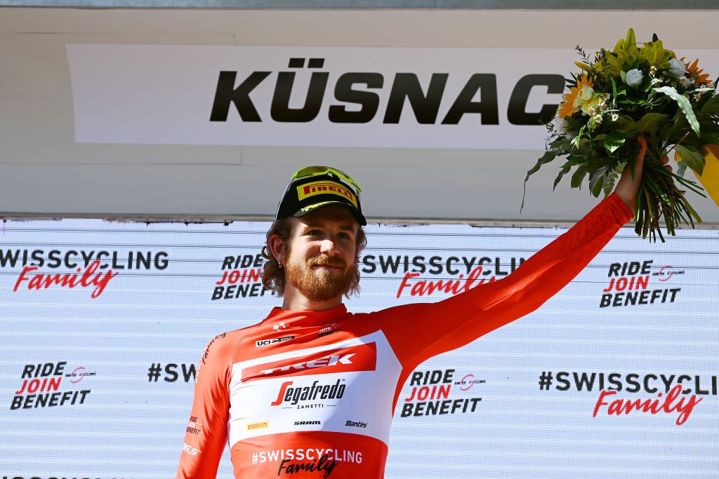 Simmons kicks to KoM jersey in racing return.