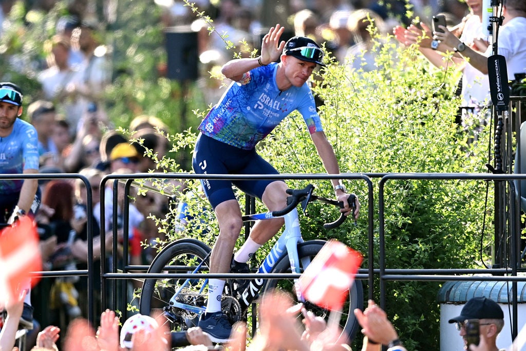 Chris Froome waves to the crowd in Copenhagen.