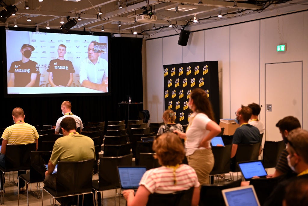 COPENHAGEN, DENMARK - JUNE 30: (L-R) Matej Mohoric of Slovenia, Jack Haig of Australia and Team Bahrain Victorious and Vladimir_Miholjević Team Performance Director (on screen) attends to the media press during the 109th Tour de France 2022 - Press Conferences / #TDF2022 / #WorldTour / on June 30, 2022 in Copenhagen, Denmark. (Photo by Stuart Franklin/Getty Images,)
