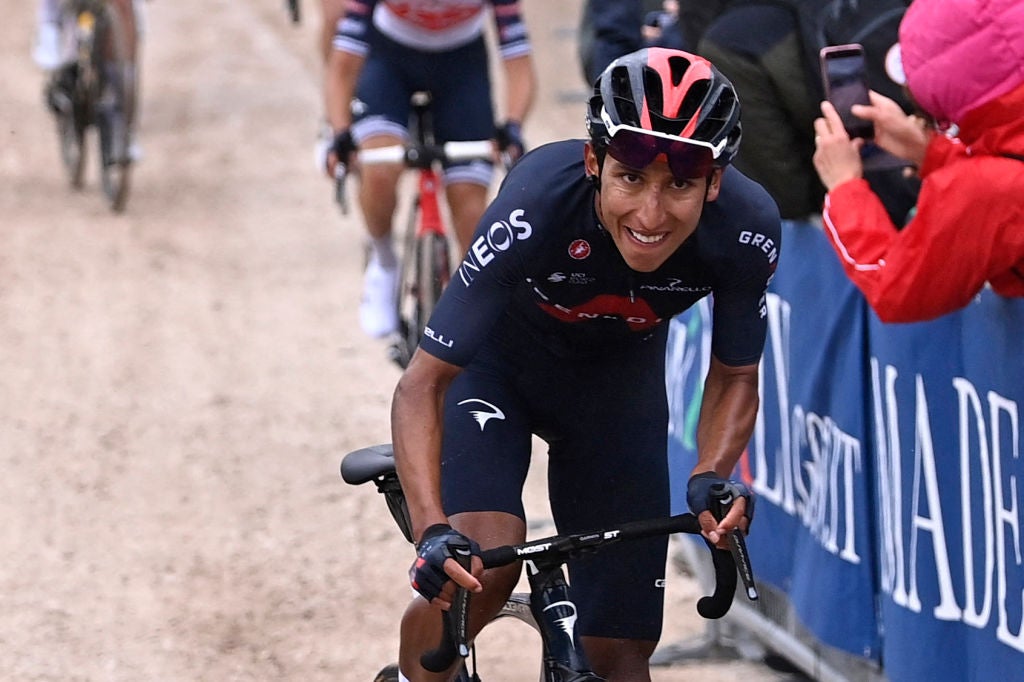 Team Ineos rider Colombia's Egan Bernal (front) reacts as prepares to cross the finish line to win the ninth stage of the Giro d'Italia 2021 cycling race, 158 km between Castel di Sangro and Campo Felice (Rocca di Cambio) on May 16, 2021. (Photo by Fabio FERRARI / POOL / AFP) / The erroneous mention[s] appearing in the metadata of this photo by Dario BELINGHERI has been modified in AFP systems in the following manner: [Fabio Ferrari] instead of [Dario Belingheri]. Please immediately remove the erroneous mention[s] from all your online services and delete it (them) from your servers. If you have been authorized by AFP to distribute it (them) to third parties, please ensure that the same actions are carried out by them. Failure to promptly comply with these instructions will entail liability on your part for any continued or post notification usage. Therefore we thank you very much for all your attention and prompt action. We are sorry for the inconvenience this notification may cause and remain at your disposal for any further information you may require. (Photo by FABIO FERRARI/POOL/AFP via Getty Images)
