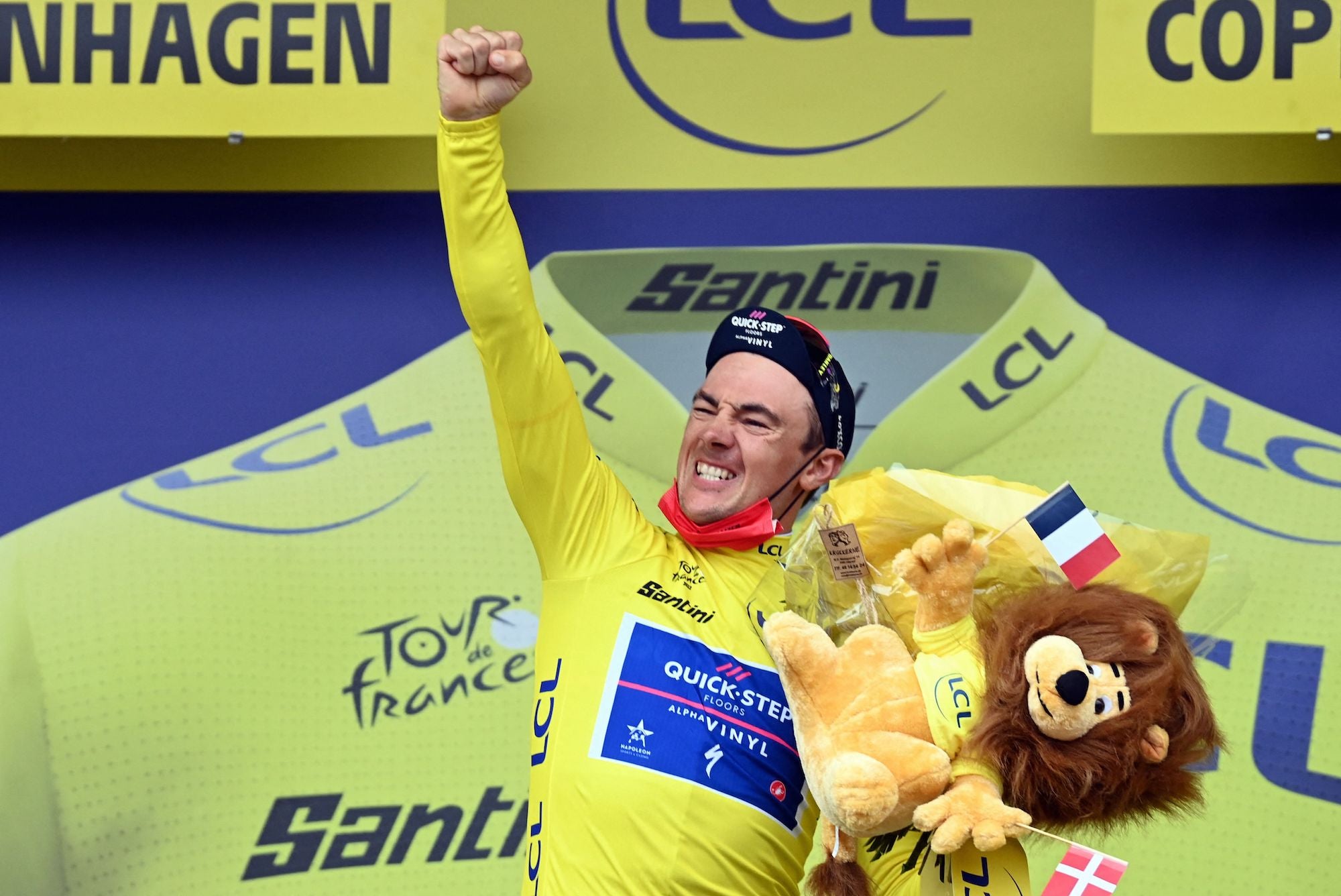 Yves Lampaert celebrates yellow.