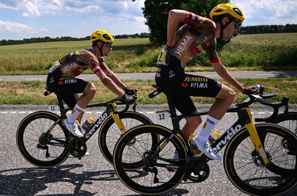 Jumbo-Visma team's Slovenian rider Primoz Roglic (L) and Jumbo-Visma team's Belgian rider Tiesj Benoot (R) cycle during the 3rd stage of the 109th edition of the Tour de France cycling race, 182 km between Vejle and Sonderborg in Denmark, on July 3, 2022. (Photo by Anne-Christine POUJOULAT / AFP) (Photo by ANNE-CHRISTINE POUJOULAT/AFP via Getty Images)