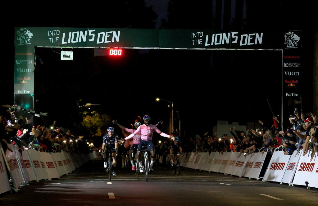 SACRAMENTO, CALIFORNIA - OCTOBER 30: Justin Williams crosses the finish line to win the Into The Lion's Den criterium race on October 30, 2021 in Sacramento, California.  Justin founded the L39ION of Los Angeles cycling team, and Cory, who finished in third place, is the team's top rider. The philosophy of the team is to advance the sport of cycling, eliminate boundaries, and promote diversity, representation, and inclusion. The team wants to grow the sport in America, and let the American masses know that you don't need to conform to be a part of the cycling community. As part of their mission,  they hosted the inaugural "Into The Lion's Den" Race in Sacramento. A total of $100,000 was handed out in prize money, making it the largest criterium purse in US history. (Photo by Ezra Shaw/Getty Images)