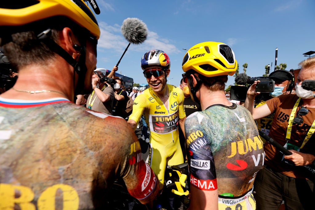 CALAIS, FRANCE - JULY 05: (L-R) Primoz Roglic of Slovenia and Jonas Vingegaard Rasmussen of Denmark congratulate his teammate Wout Van Aert of Belgium and Team Jumbo - Visma Yellow Leader Jersey after win the 109th Tour de France 2022, Stage 4 a 171,5km stage from Dunkerque to Calais / #TDF2022 / #WorldTour / on July 05, 2022 in Calais, France. (Photo by Guillaume Horcajuelo - Pool/Getty Images)