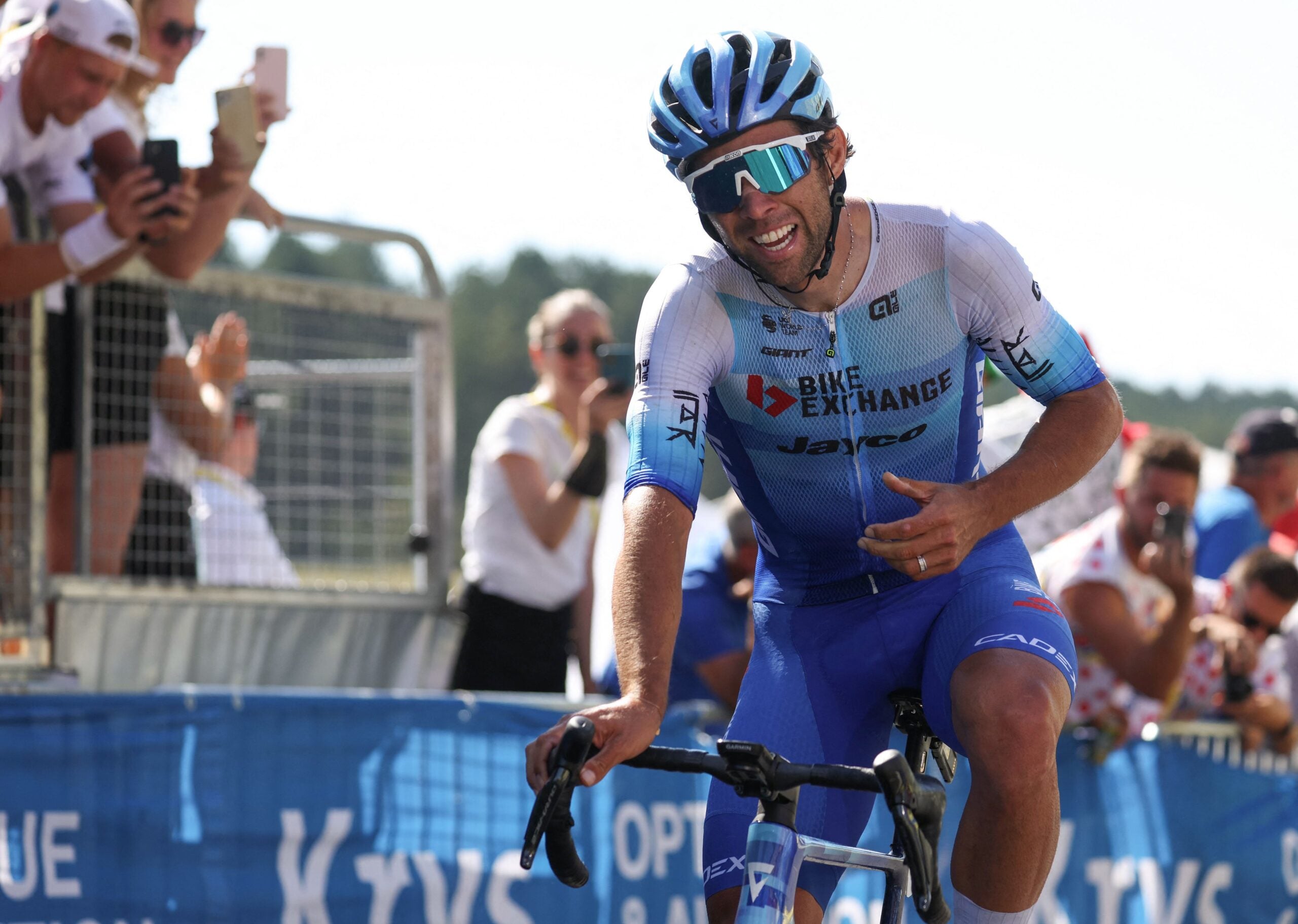 Team Bikeexchange-Jayco team's Australian rider Michael Matthews celebrates as he cycles to the finish line to win the 14th stage of the 109th edition of the Tour de France cycling race, 192,5 km between Saint-Etienne and Mende in central France, on July 16, 2022. (Photo by Thomas SAMSON / AFP) (Photo by THOMAS SAMSON/AFP via Getty Images)
