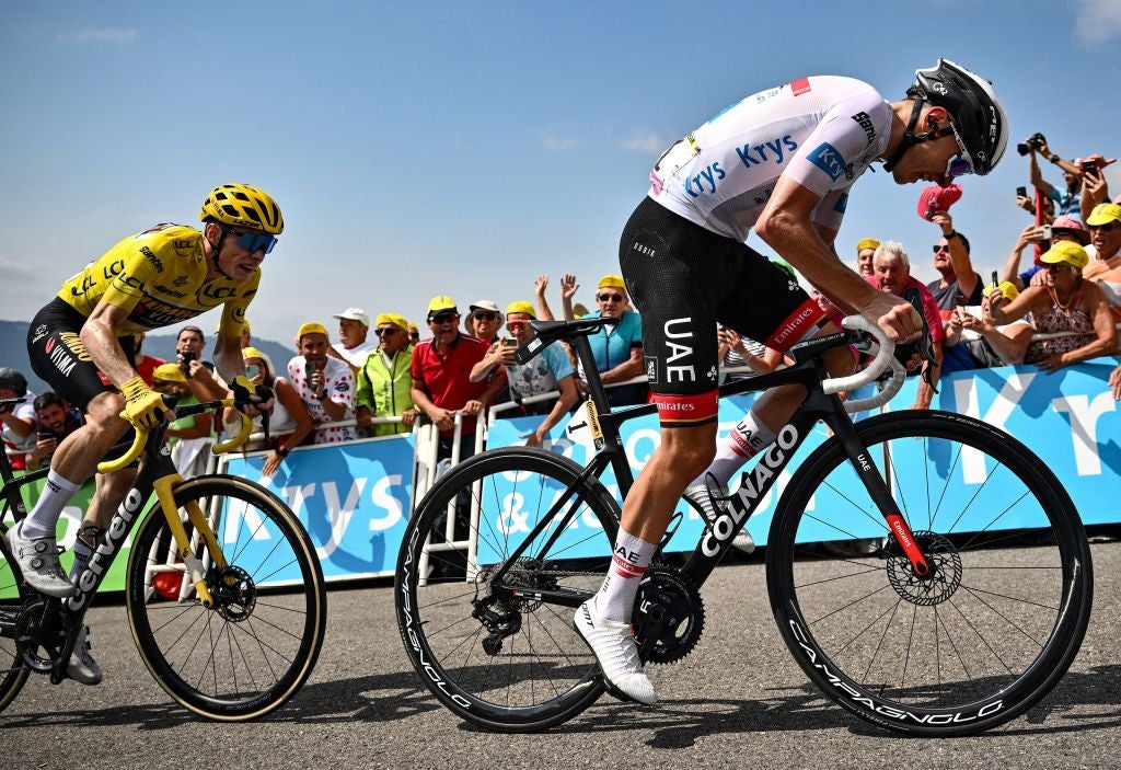UAE Team Emirates team's Slovenian rider Tadej Pogacar (R) wearing the best young rider's white jersey cycles ahead of Jumbo-Visma team's Danish rider Jonas Vingegaard (L) wearing the overall leader's yellow jersey to the finish line to win the 17th stage of the 109th edition of the Tour de France cycling race, 129,7 km between Saint-Gaudens and Peyragudes, in southwestern France, on July 20, 2022. (Photo by Marco BERTORELLO / AFP) (Photo by MARCO BERTORELLO/AFP via Getty Images)
