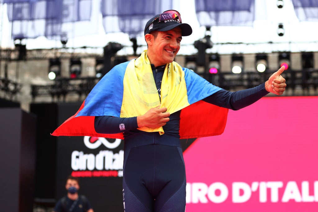 VERONA, ITALY - MAY 29: Richard Carapaz of Ecuador and Team INEOS Grenadiers celebrates at podium with the Ecuador flag as second overall place during the 105th Giro d'Italia 2022, Stage 21 a 17,4km individual time trial stage from Verona to Verona / ITT / #Giro / #WorldTour / on May 29, 2022 in Verona, Italy. (Photo by Michael Steele/Getty Images)