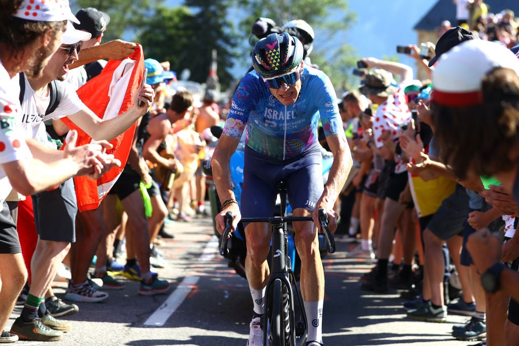 ALPE D'HUEZ, FRANCE - JULY 14: Christopher Froome of United Kingdom and Team Israel - Premier Tech competes in the breakaway passing through The Dutch corner climbing to the L'Alpe d'Huez while fans cheer during the 109th Tour de France 2022, Stage 12 a 165,1km stage from Briançon to L'Alpe d'Huez 1471m / #TDF2022 / #WorldTour / on July 14, 2022 in Alpe d'Huez, France. (Photo by Michael Steele/Getty Images)