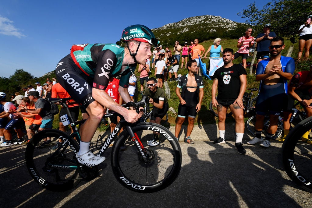 Sam Bennett riding through fans on stage 9
