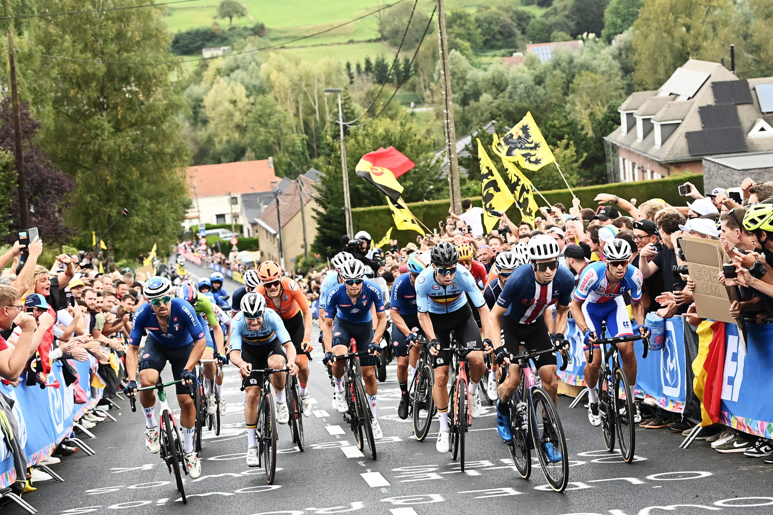 LEUVEN, BELGIUM - SEPTEMBER 26: (L-R) Sonny Colbrelli of Italy, Remco Evenepoel of Belgium, Andrea Bagioli of Italy, Wout Van Aert of Belgium, Neilson Powless of The United States and Zdenek Stybar of Czech Republic compete in the Breakaway while fans cheer during the 94th UCI Road World Championships 2021 - Men Elite Road Race a 268,3km race from Antwerp to Leuven / #flanders2021 / on September 26, 2021 in Leuven, Belgium. (Photo by Alex Broadway - Pool/Getty Images)