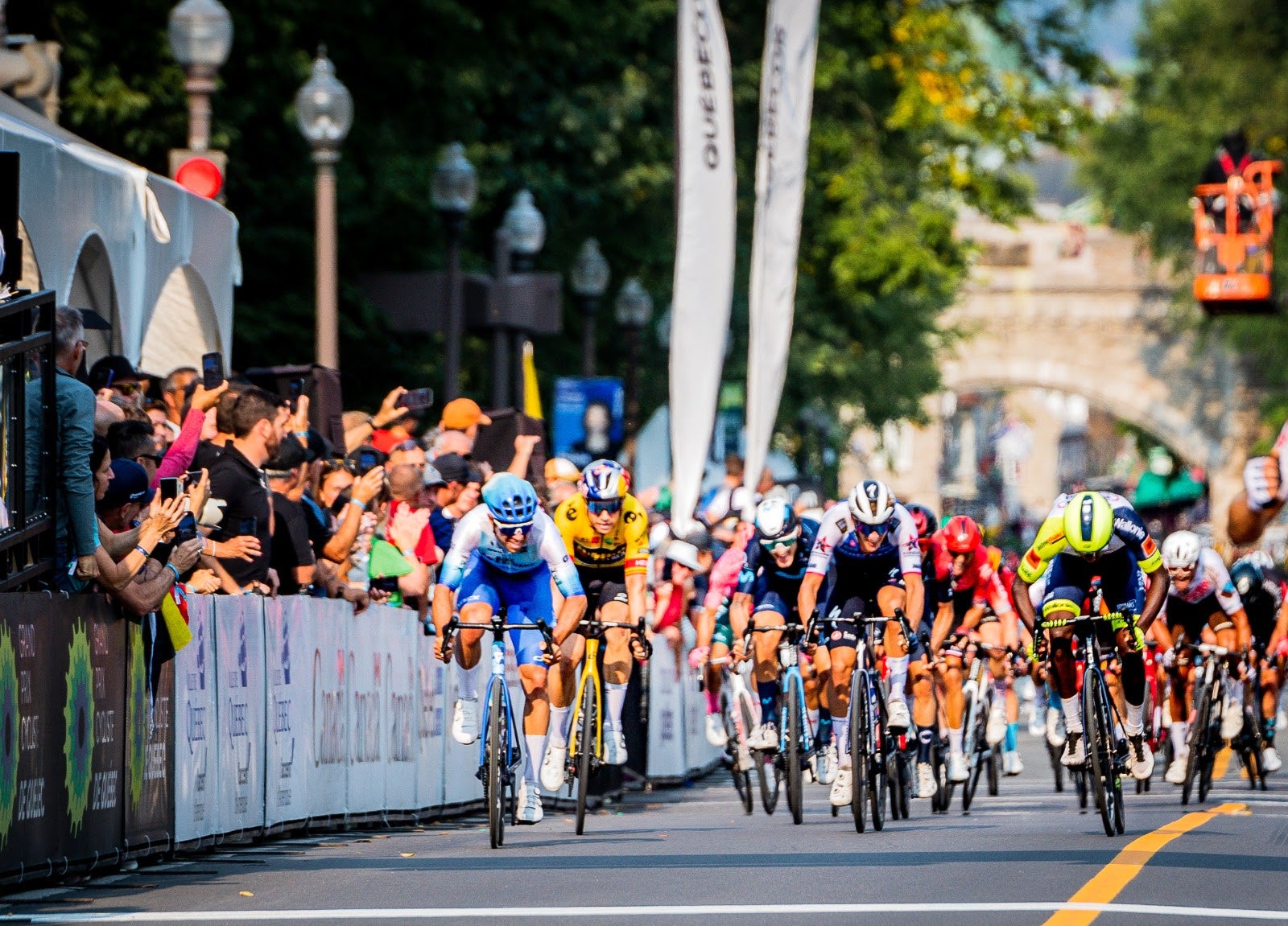 Girmay kicks to third against a world-class field Friday in Québec.