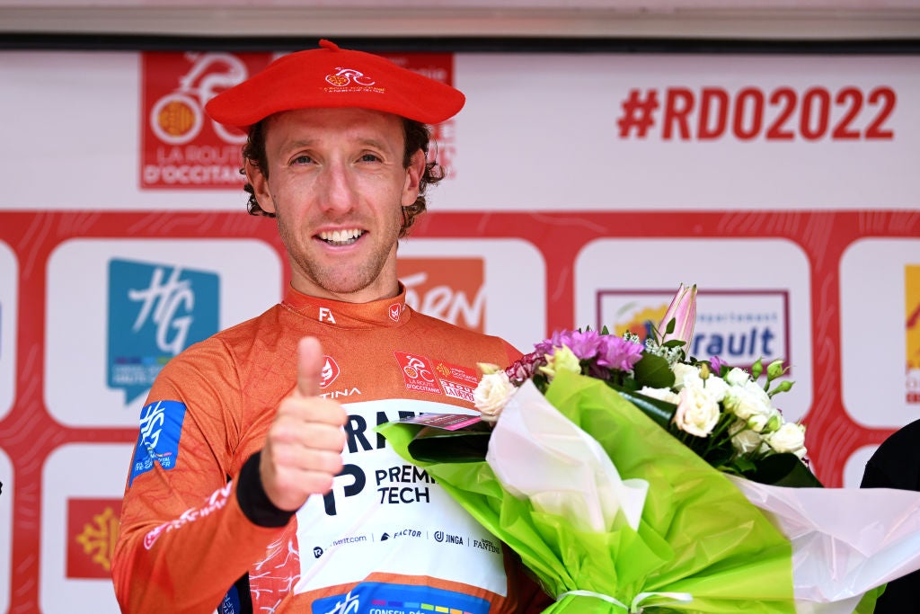 AUTERIVE, FRANCE - JUNE 19: Michael Woods of Canada and Team Israel - Premier Tech Red Leader Jersey celebrates at podium as final race winner during the 46th La Route d'Occitanie - La Depeche du Midi 2022 - Stage 4 a 188,3km stage from Les Angles to Auterive / #RDO2022 / on June 19, 2022 in Auterive, France. (Photo by Dario Belingheri/Getty Images)