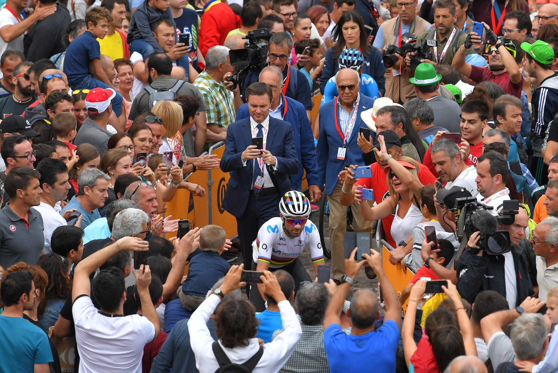 UCI President David Lappartient looks to take a photo of Alejandro Valverde