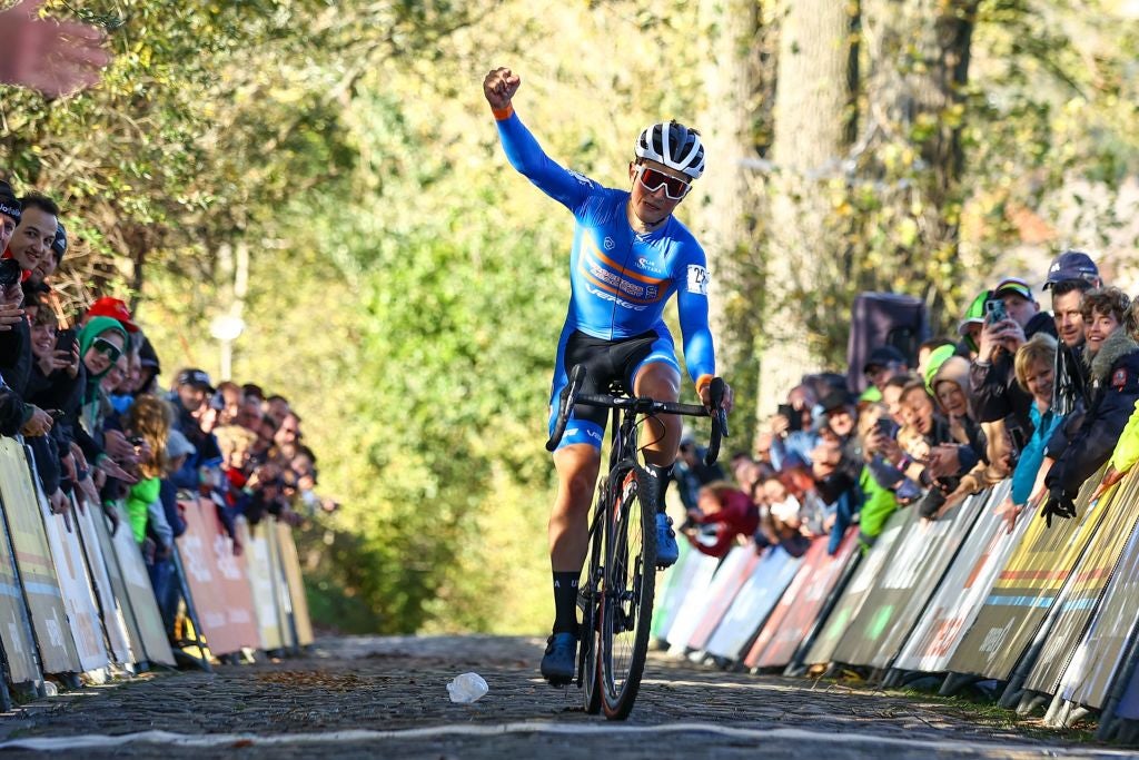 US Andrew August celebrates as he crosses the finish line to win the junior men's race during the Koppenbergcross, the first race (out of eight) of the X2O Badkamers trophy, in Melden, on Tuesday 01 November 2022. BELGA PHOTO DAVID PINTENS (Photo by DAVID PINTENS / BELGA MAG / Belga via AFP) (Photo by DAVID PINTENS/BELGA MAG/AFP via Getty Images)