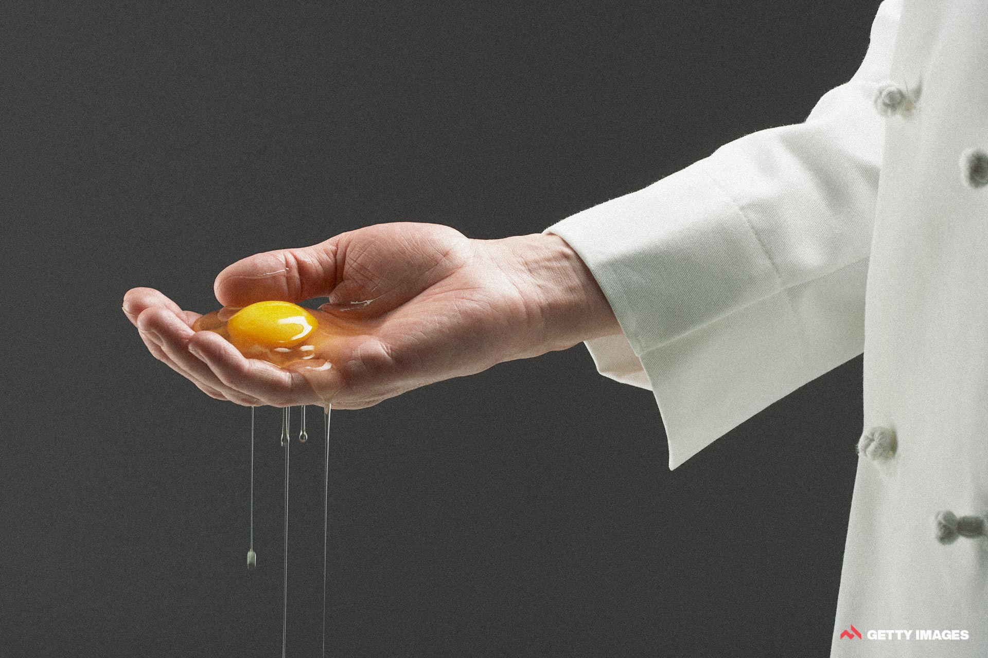 Getty's excellent metadata would have you believe that this is a "chef holding raw egg in his cupped hand", but I'll let you make up your own mind.