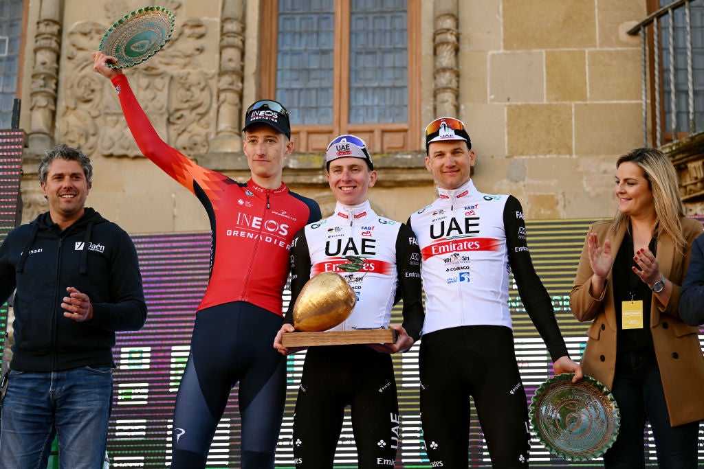 Pogačar poses with the 'golden olive' after winning Monday's race.