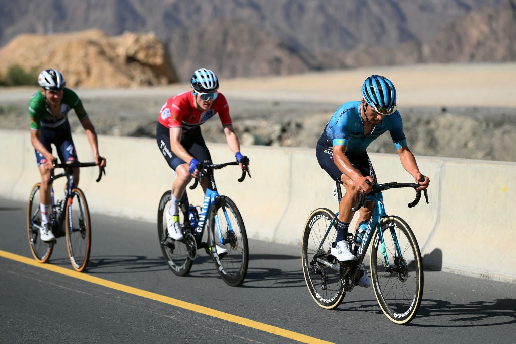 Matteo Jorgenson follows Alexey Lutsenko during stage 4 of the Tour of Oman