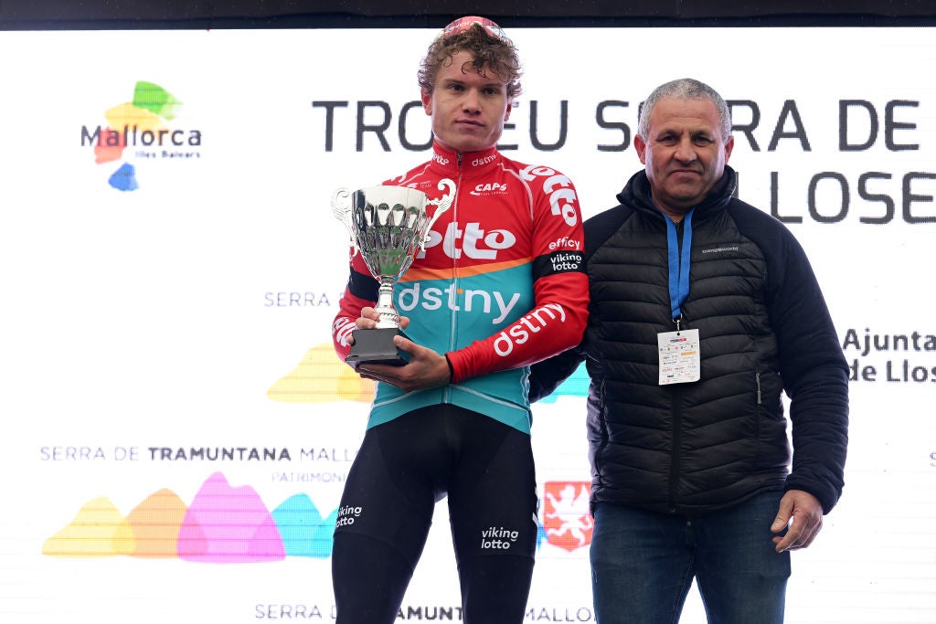 LLOSETA, SPAIN - JANUARY 28: Lennert van Eetvelt of Belgium and Team Lotto-Dstny on second place poses on the podium ceremony after the 32nd Challenge Ciclista Mallorca 2023 - Trofeo Serra de Tramuntana a 123km one day race from Lloseta to Lloseta / (Race route modified due to bad weather conditions) / #ChallengeMallorca / on January 28, 2023 in Lloseta, Spain. (Photo by Dario Belingheri/Getty Images)
