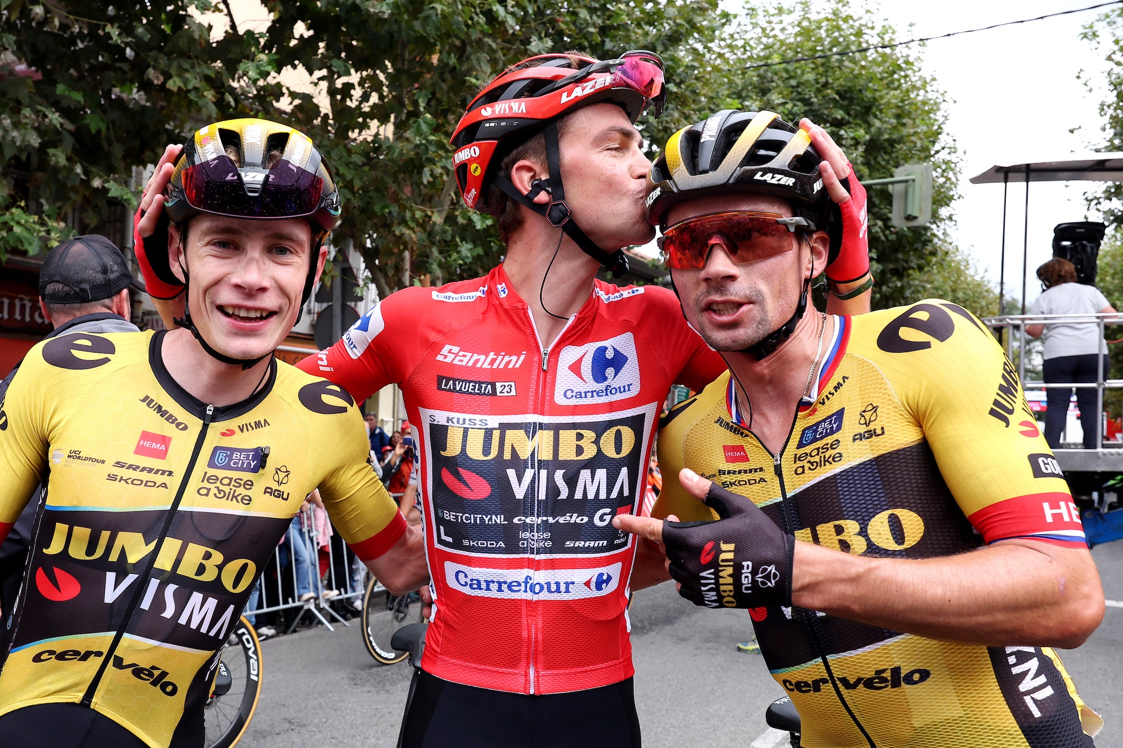 GUADARRAMA, SPAIN - SEPTEMBER 16: (L-R) Jonas Vingegaard of Denmark, Sepp Kuss of The United States - Red Leader Jersey final overall winner and Primož Roglic of Slovenia and Team Jumbo-Visma celebrate the victory during the 78th Tour of Spain 2023, Stage 20 a 207.8km stage from Manzanares El Real to Guadarrama / #UCIWT / on September 16, 2023 in Guadarrama, Spain. (Photo by Alexander Hassenstein/Getty Images)