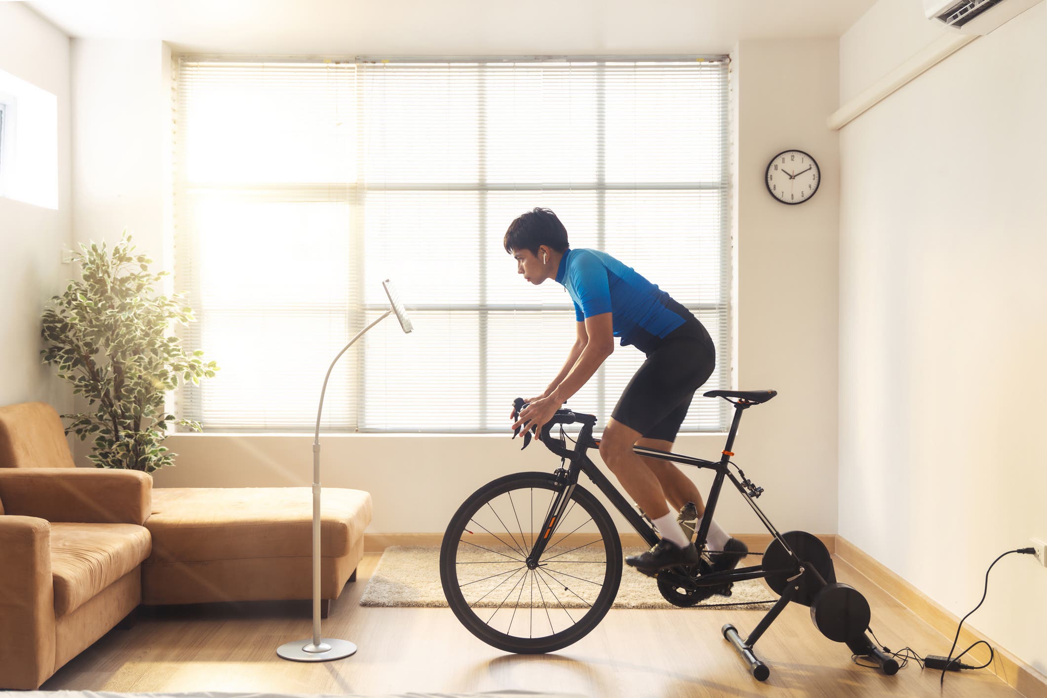 Cyclist on indoor trainer. How to prepare for outdoor races by riding inside.