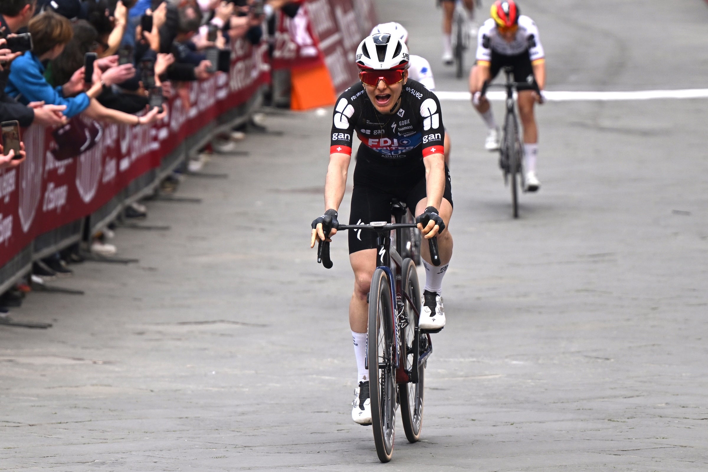 Elise Chabbey (FDJ United - SUEZ) celebrates at finish line as winner of the Strade Bianche Donne 2026 (Photo: Luc Claessen/Getty Images)
