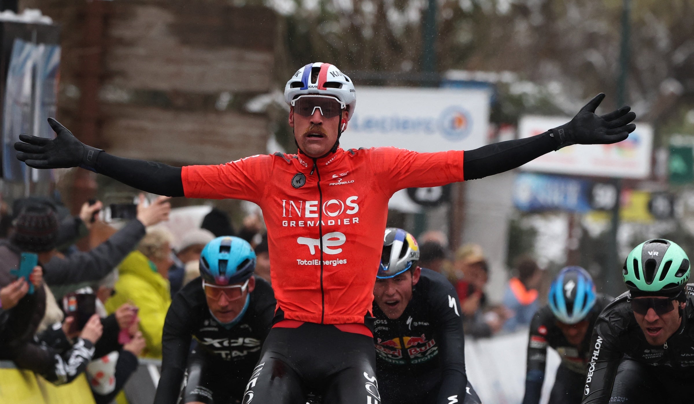 Dorian Godon celebrates his win on the seventh stage of Paris-Nice cycling race (Photo by Anne-Christine Poujoulat / AFP)