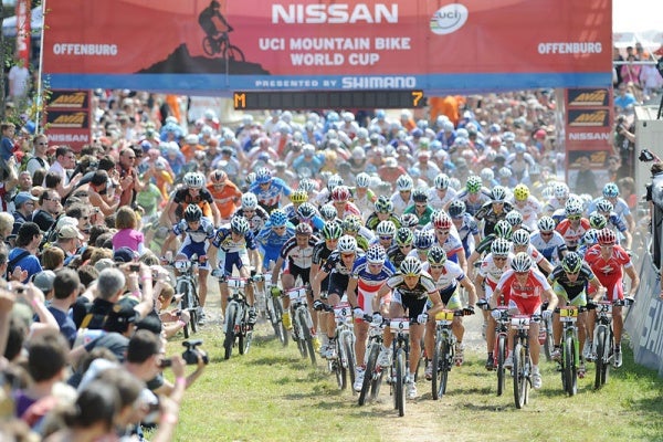 2008 Tour de France, stage 12: The peloton approaches the finish, with three men still off the front.